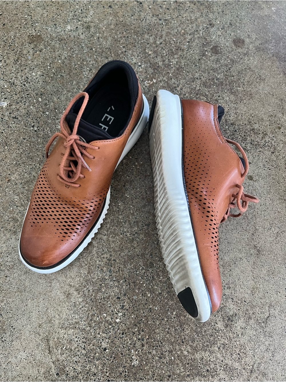 Cole Haan Zerogrand laser wingtip oxfords in British Tan | Ivory